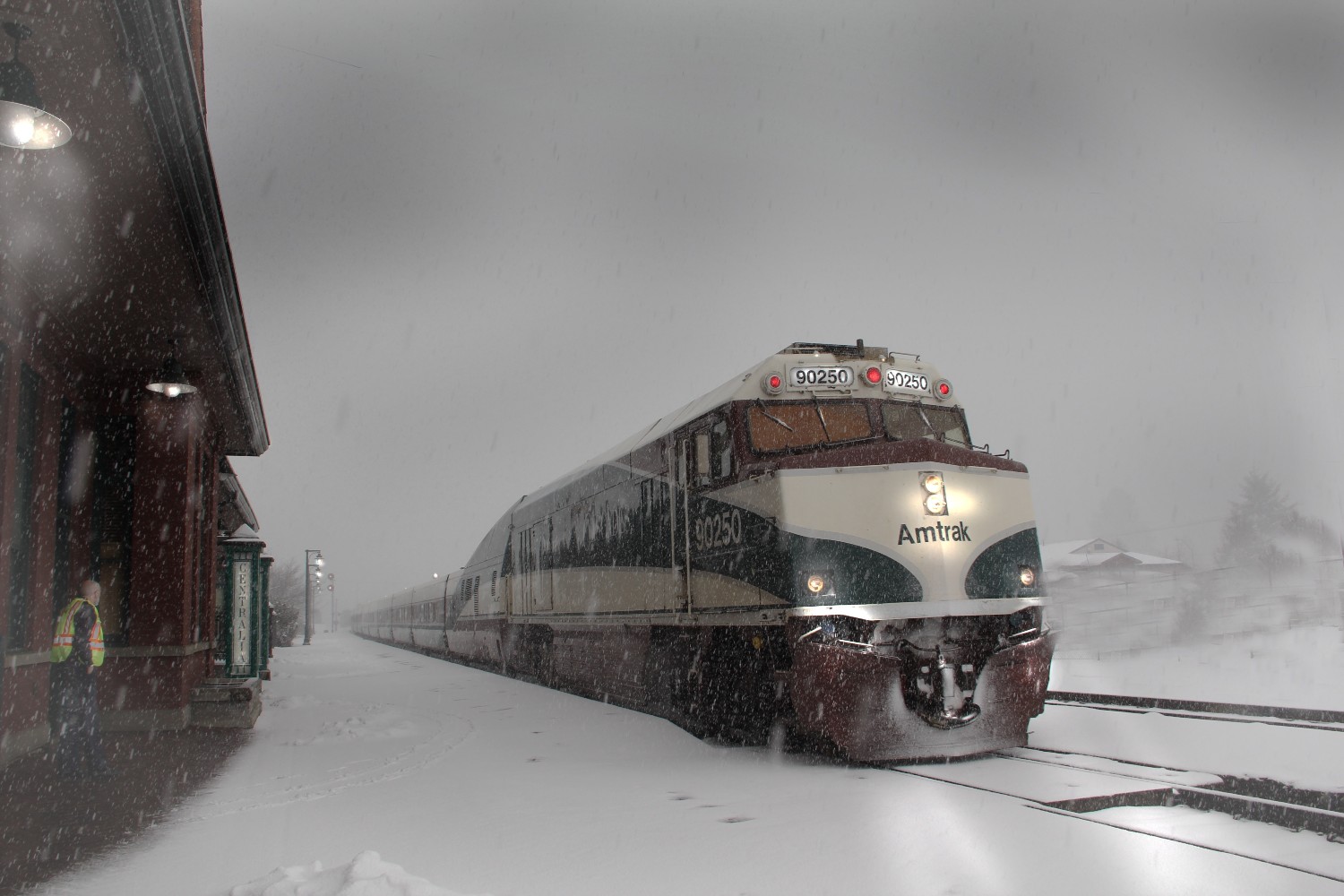 An Amtrak train pulls into the station during a snowstorm