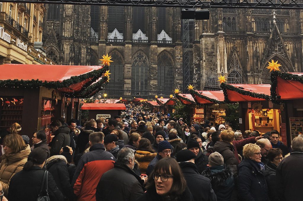Photo of a busy Christmas market in Cologne.