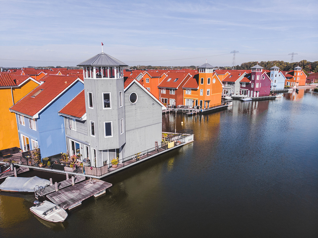 Colorful houses on the water in Groningen, Netherlands.
