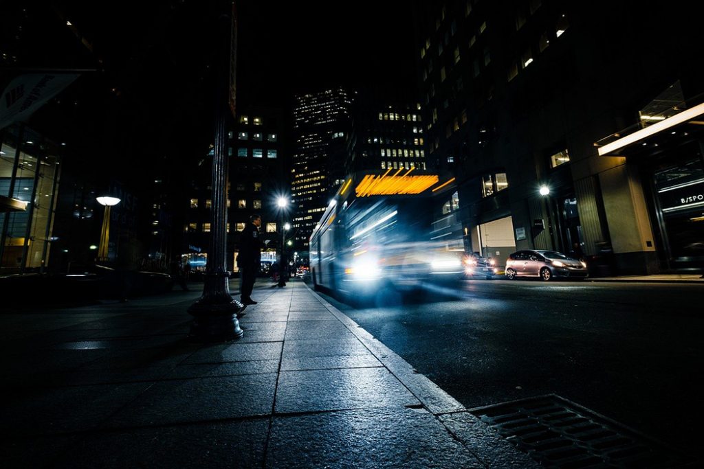 Photo of a bus traveling overnight between cities.