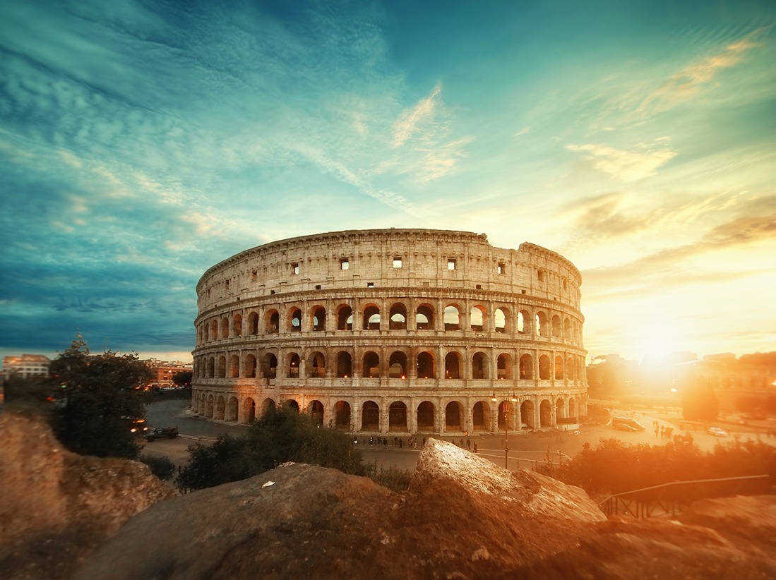 Cinematic photo of The Colosseum in Rome at sunrise.