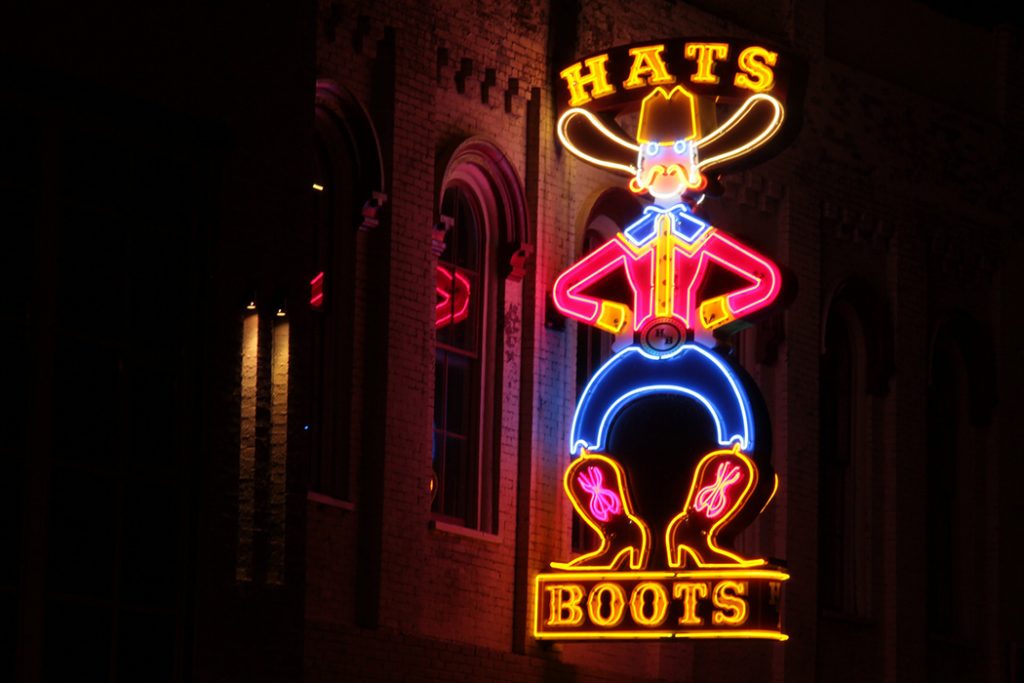 Photo of a honky-tonk sign in downtown Nashville.