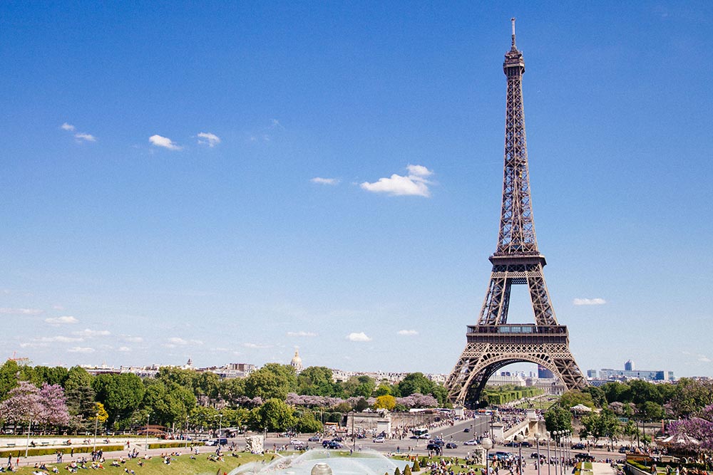 Photo of the Eiffel Tower on a sunny day in Paris.